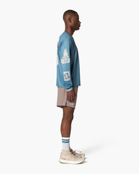 Maglia a maniche lunghe azzurro petrolio, indossata, vista laterale