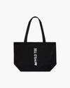 Borsa tote in tela nera con manici lunghi e logo Wild Tee bianco, vista frontale